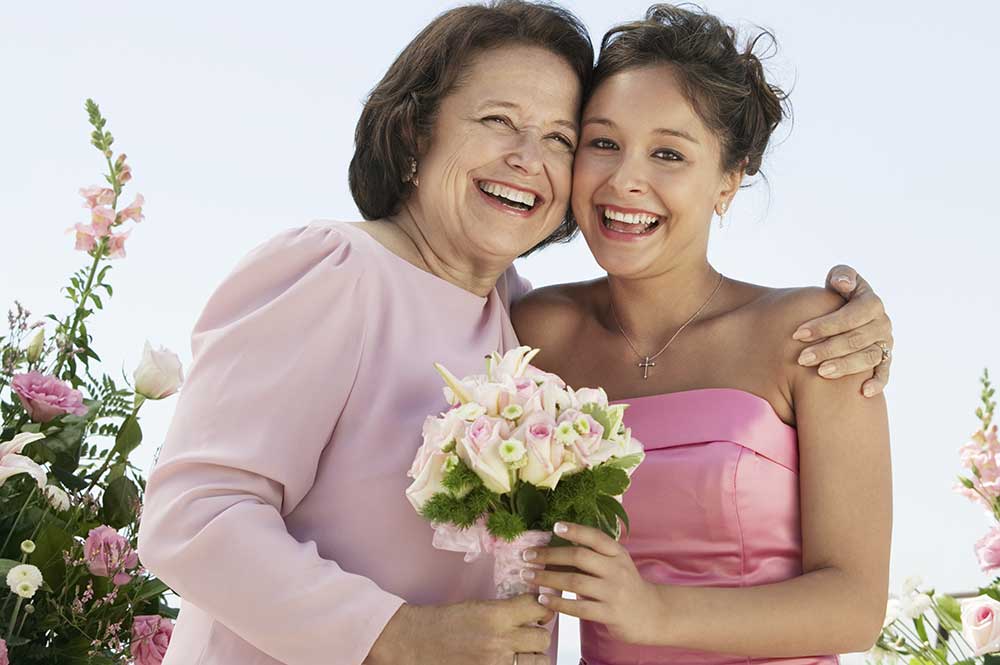 Mother and Bride with bouquet outdoors